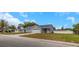 Charming single-story home featuring a two-car garage, covered front porch, and a large front yard at 5214 Idlewild St, New Port Richey, FL 34653