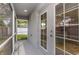 View of a screened patio with a door leading inside to the home's kitchen at 5214 Idlewild St, New Port Richey, FL 34653