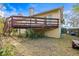 Backyard view of a raised wooden deck overlooking the lawn at 5422 Foley Sq, New Port Richey, FL 34652