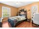 Cozy bedroom with dinosaurs, a guitar, and plenty of natural light at 5422 Foley Sq, New Port Richey, FL 34652