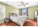 Bedroom featuring a large window, ceiling fan, and natural light at 5422 Foley Sq, New Port Richey, FL 34652