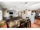 Spacious dining area with hardwood floors, seamlessly connects to the living room and kitchen at 5422 Foley Sq, New Port Richey, FL 34652