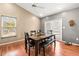Dining area features hardwood floors, vaulted ceilings, and natural light for comfortable everyday dining at 5422 Foley Sq, New Port Richey, FL 34652