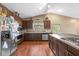 Well-equipped kitchen with stainless steel appliances, dark wood cabinets, and ample counter space for meal preparation at 5422 Foley Sq, New Port Richey, FL 34652