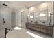 Luxurious bathroom featuring marble walls, a soaking tub, a glass-enclosed shower, and modern fixtures at 5457 Creek Ridge Rd, Brooksville, FL 34601