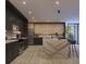 Gorgeous kitchen with island seating, modern appliances, and bright view through sliding glass doors at 5457 Creek Ridge Rd, Brooksville, FL 34601