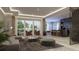 Open concept living room featuring lots of light, modern decor and an adjacent kitchen at 5477 Creek Ridge Rd, Brooksville, FL 34601