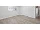 Bedroom featuring wood-look flooring, white walls, and closet at 5512 Tropic Dr, New Port Richey, FL 34653