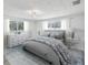 Bedroom featuring large windows, ceiling fan and neutral tones at 5512 Tropic Dr, New Port Richey, FL 34653
