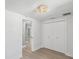Bedroom featuring wood-look flooring and double closet at 5512 Tropic Dr, New Port Richey, FL 34653