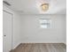 Bedroom featuring wood-look flooring and a ceiling light fixture at 5512 Tropic Dr, New Port Richey, FL 34653
