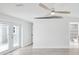 Spacious bedroom featuring light wood floors, and french doors leading to a side yard at 5512 Tropic Dr, New Port Richey, FL 34653