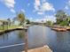 A picturesque canal view from the dock showcasing the calm waters and neighboring properties at 5512 Tropic Dr, New Port Richey, FL 34653