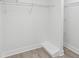 Walk-in closet with wire shelving, hardwood floors, and ample storage space, perfect for organizing your wardrobe at 5512 Tropic Dr, New Port Richey, FL 34653