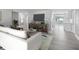 Open concept living room showcasing updated floors and neutral decor at 5512 Tropic Dr, New Port Richey, FL 34653