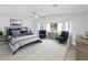 Bright main bedroom with large windows, sitting area and king size bed at 5512 Tropic Dr, New Port Richey, FL 34653
