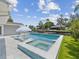 Stunning pool and patio with a canal view, perfect for relaxation and entertaining at 5512 Tropic Dr, New Port Richey, FL 34653