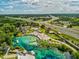 Gorgeous aerial view of Weeki Wachee Springs with clear waters, water slides, and recreational facilities at 6076 Shiprock Ave, Spring Hill, FL 34608