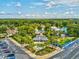 Aerial shot of the Weeki Wachee Springs entrance showcasing the fountain, palm trees, and guest services building at 6076 Shiprock Ave, Spring Hill, FL 34608