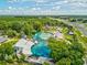 Scenic aerial view of Weeki Wachee Springs featuring clear blue water, water slides, and lush greenery at 6076 Shiprock Ave, Spring Hill, FL 34608