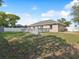 Spacious backyard featuring a wooden deck perfect for outdoor entertaining and relaxation at 6076 Shiprock Ave, Spring Hill, FL 34608