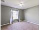 Neutral bedroom with carpet, ceiling fan, window with curtains at 6076 Shiprock Ave, Spring Hill, FL 34608