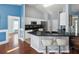 Kitchen features stainless appliances, a breakfast bar with seating and an open concept design at 6076 Shiprock Ave, Spring Hill, FL 34608