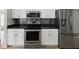 Modern kitchen featuring stainless steel appliances, sleek countertops and white cabinets at 6076 Shiprock Ave, Spring Hill, FL 34608