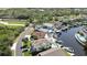 Aerial view capturing waterfront homes with boat docks and private pools, exemplifying a coveted waterfront lifestyle at 6340 Spoonbill Dr, New Port Richey, FL 34652