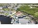 Aerial shot featuring waterfront homes with pools, docks, and solar panels, highlighting modern amenities and a coastal community at 6340 Spoonbill Dr, New Port Richey, FL 34652
