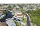 An aerial view shows a waterfront community with homes on canals, many featuring private docks and swimming pools at 6340 Spoonbill Dr, New Port Richey, FL 34652