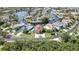 Aerial view showcasing a waterfront home with a private pool and canal access, offering a luxurious and serene lifestyle at 6340 Spoonbill Dr, New Port Richey, FL 34652