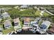Aerial view featuring a waterfront community with private docks, pools, and lush landscaping, offering a serene coastal lifestyle at 6340 Spoonbill Dr, New Port Richey, FL 34652