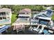 Aerial view of backyard with pool, patio furniture, boat dock and waterfront access at 6340 Spoonbill Dr, New Port Richey, FL 34652