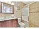 Bathroom featuring tiled shower, modern vanity and lighting at 6340 Spoonbill Dr, New Port Richey, FL 34652
