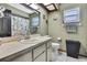 Bathroom with a shower, sink, toilet, framed mirror, decorative shower curtain and towel rack at 6340 Spoonbill Dr, New Port Richey, FL 34652