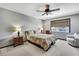 Comfortable bedroom with neutral tones, lots of light, ceiling fan, and classic wood furniture at 6340 Spoonbill Dr, New Port Richey, FL 34652