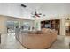 Spacious living room with expansive sectional and large windows offering natural light at 6340 Spoonbill Dr, New Port Richey, FL 34652