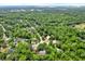 Overhead perspective of a residential area with dense tree coverage, providing privacy and a natural setting at 642 Erin Way, Brooksville, FL 34601