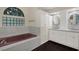 Bathroom with an undermount tub and double sink vanity at 642 Erin Way, Brooksville, FL 34601