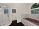 Bathroom featuring a frameless shower and an undermount tub at 642 Erin Way, Brooksville, FL 34601