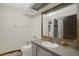 Bathroom featuring a framed mirror over the sink and a shower with a curtain at 642 Erin Way, Brooksville, FL 34601