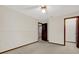 Neutral bedroom with wall to wall carpeting and dark wood trim at 642 Erin Way, Brooksville, FL 34601