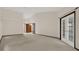 Large bedroom with french doors and neutral carpeting at 642 Erin Way, Brooksville, FL 34601