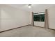 Bedroom with wall to wall carpeting, window, and neutral paint at 642 Erin Way, Brooksville, FL 34601