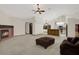 Open concept living room next to kitchen with corner fireplace at 642 Erin Way, Brooksville, FL 34601