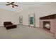 Spacious living room featuring vaulted ceilings, a fireplace, and plush carpeting at 642 Erin Way, Brooksville, FL 34601