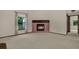 A spacious living room featuring a fireplace and large window at 642 Erin Way, Brooksville, FL 34601