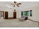 Inviting living area featuring comfortable seating, a fan, and natural light at 642 Erin Way, Brooksville, FL 34601