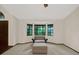 Cozy sitting area featuring a comfortable chair, ottoman, and natural light from the bay window at 642 Erin Way, Brooksville, FL 34601